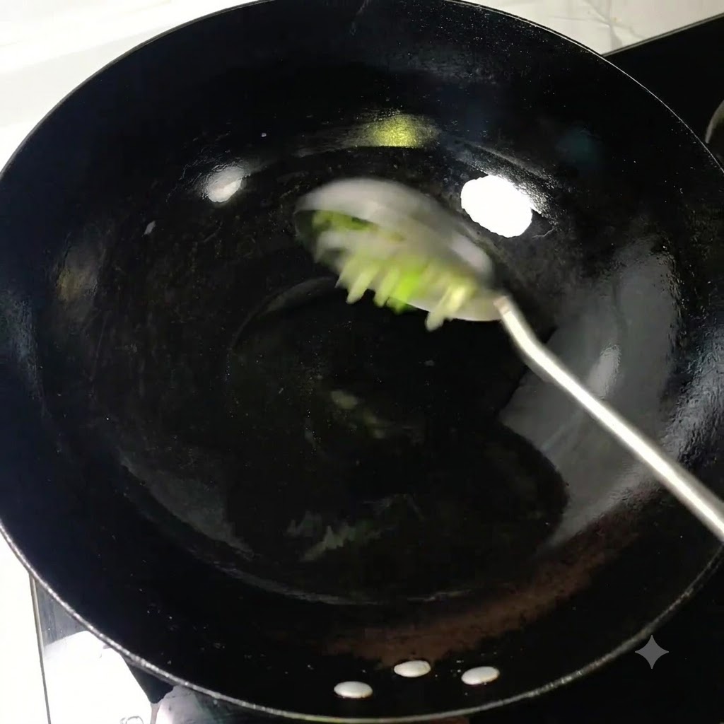 Chopped scallions being stirred with a ladle in hot oil inside a black wok.