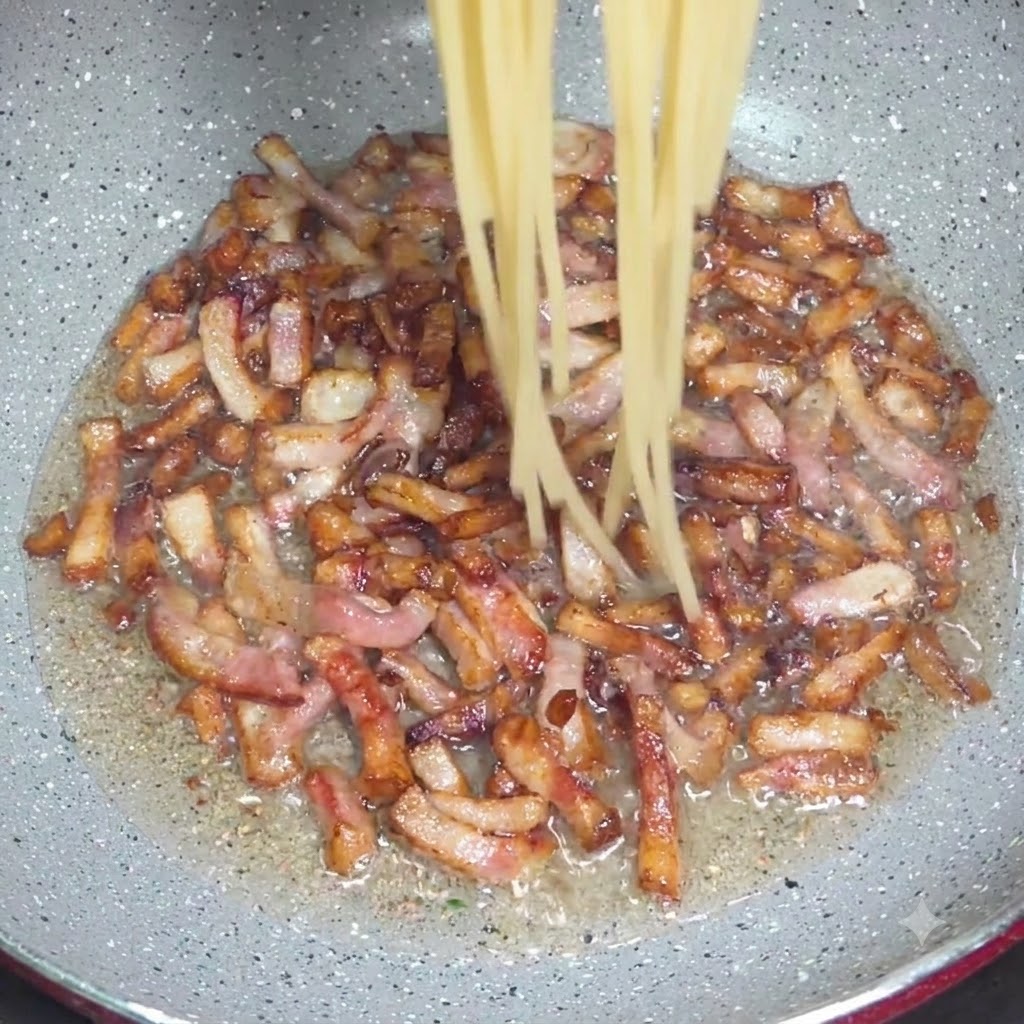 Ugotowane nitki spaghetti wrzucane szczypcami do patelni z chrupiącymi kawałkami guanciale.